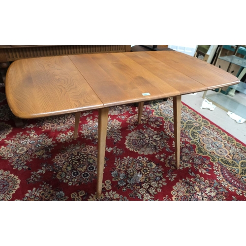 942 - A 1960's rectangular Ercol elm drop-leaf dining table, model 383