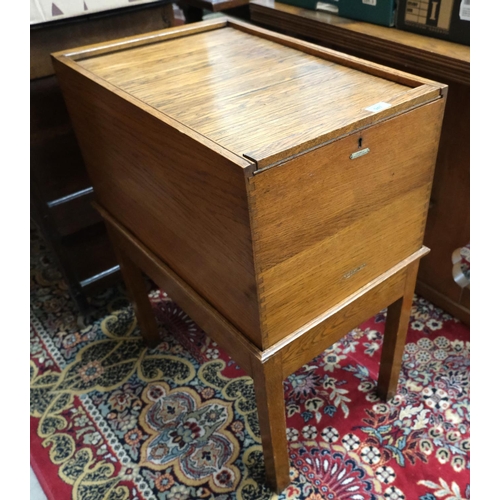 947 - A 1930's golden oak office filing cabinet with tambour top labelled 