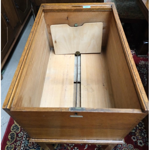 947 - A 1930's golden oak office filing cabinet with tambour top labelled 