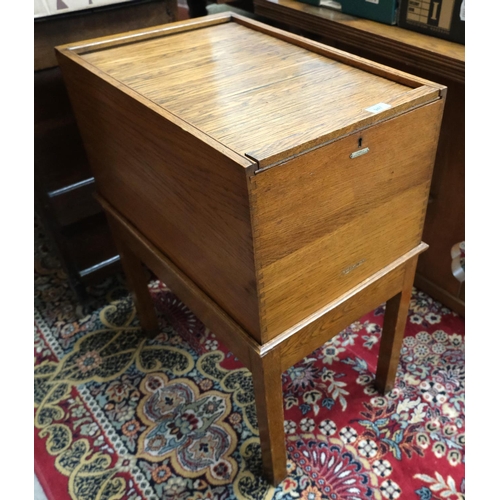 947 - A 1930's golden oak office filing cabinet with tambour top labelled 