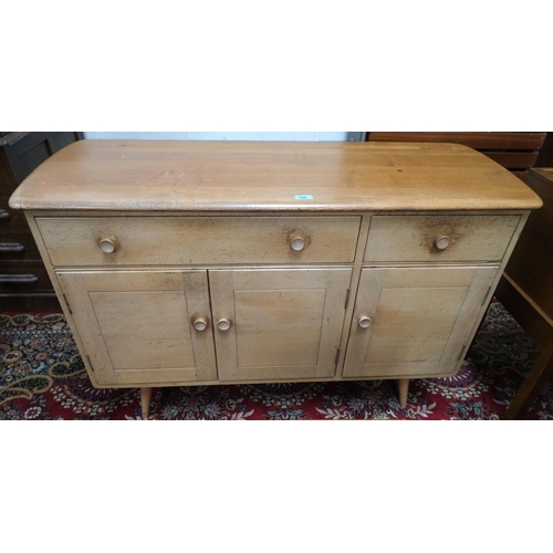 948 - A 1960's Ercol light elm sideboard of 2 drawers and 3 cupboards, model 1351 with blue label