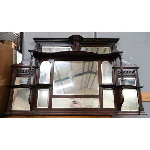 956 - A Victorian walnut overmantel mirror with bevelled panels and display shelves with turned support pi... 