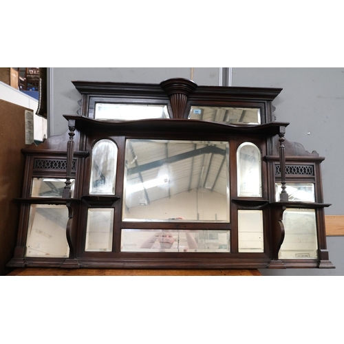 956 - A Victorian walnut overmantel mirror with bevelled panels and display shelves with turned support pi... 