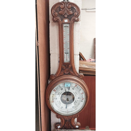 10 - A carved oak aneroid barometer by Schierwater & LLoyd Liverpool (glass a.f)