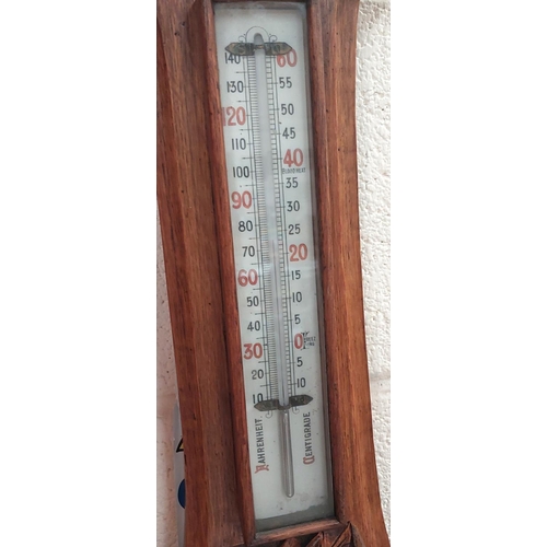 10 - A carved oak aneroid barometer by Schierwater & LLoyd Liverpool (glass a.f)