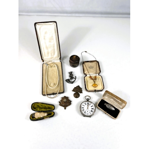 107 - A silver cased open faced key wound pocket watch; military cap badges, jewellery etc.