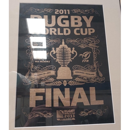 129 - A 2011 World Rugby Cup poster and an originally signed photo of Dan Carter and Richie McCaw.