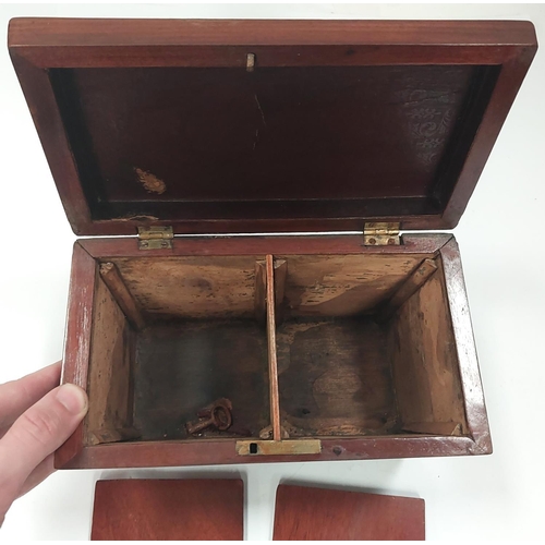 26 - A Georgian mahogany dome top tea caddy on bun feet with two interior compartments.