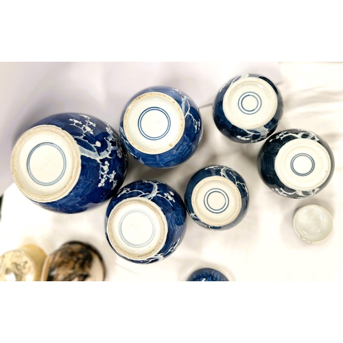 409 - A collection of Chinese blue and white ginger jars of various sizes, some with double circle marks t... 