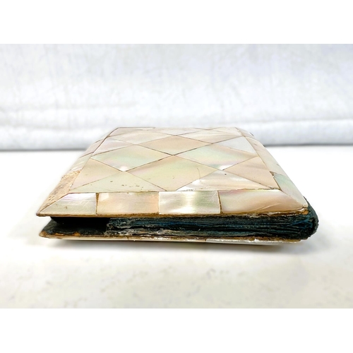 41 - A Victorian mother of pearl card case, 14cm and a similar with engraved decoration. 