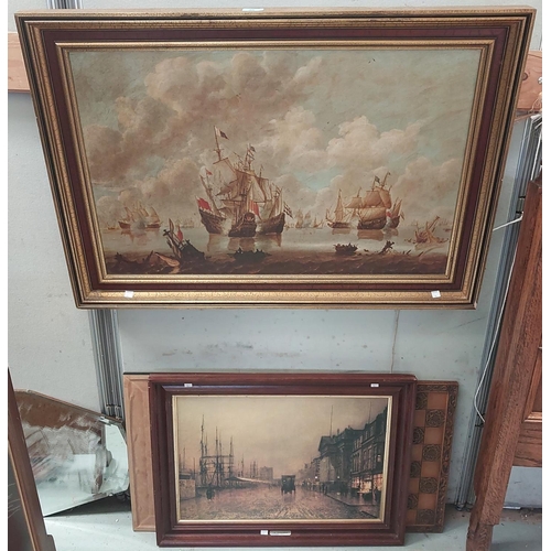 46 - A print of Ships framed in gilt and a street scene framed