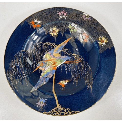 528 - A Carlton ware 'Sketching Bird' pattern shallow dish with wide rim, enamelled and gilded bird over g... 