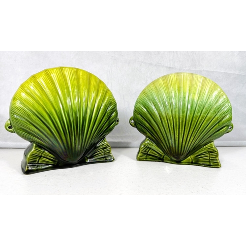 537 - Ault Art Pottery: A near matching pair of scallop shell shaped vases with shaded green glaze each wi... 