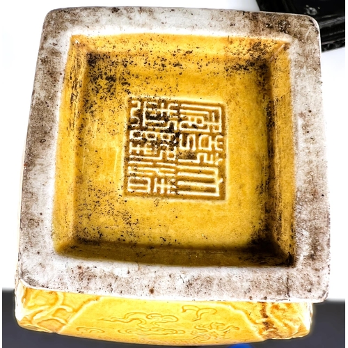 576D - A Chinese yellow glazed vase squared baluster form with relief scrolling decoration including bats e... 