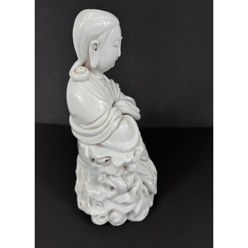 577 - A Chinese blanc de chine figure of Guanyin seated on cloud formation, height 23cm impressed mark to ... 