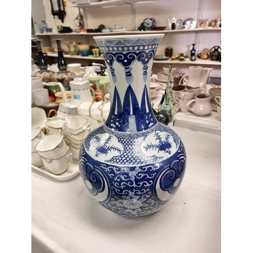 578 - A Chinese blue and white vase with bulbous body and a tapering and flaring neck, dragons and other d... 