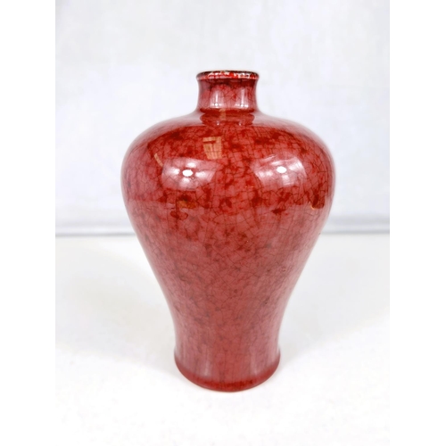 578D - A Chinese ox blood 'Mei ping' shaped vase, height 19cm and wooden stand