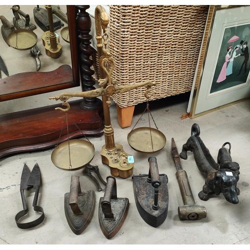 154 - A Brass set of balance scales with integral weights, sausage dog boot scraper, antique irons and met... 