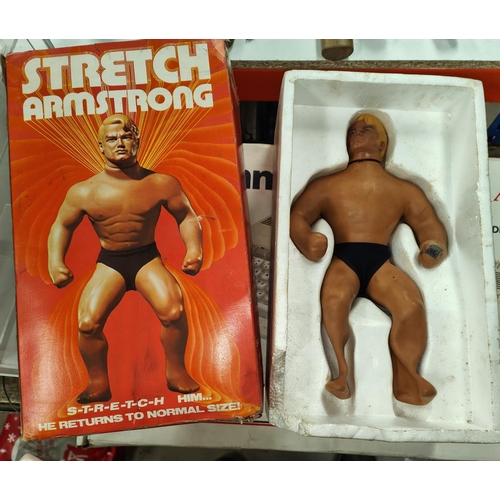 318 - An original Denys Fisher Stretch Armstrong in original box (top lid missing).