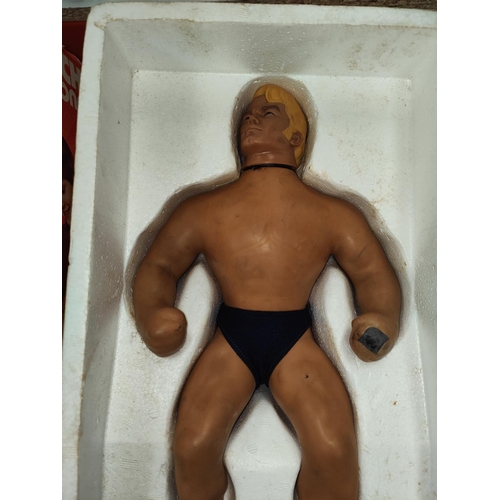 318 - An original Denys Fisher Stretch Armstrong in original box (top lid missing).