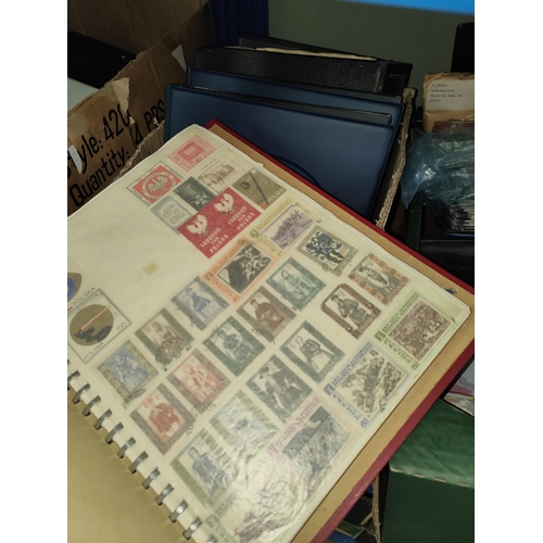 345 - World stamps in four albums/stock book.