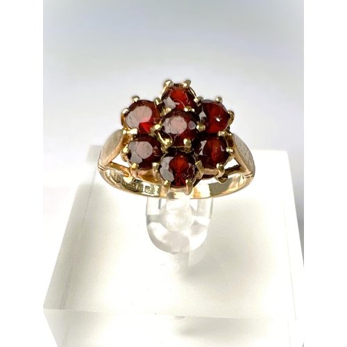 597 - A suite of garnet set 9carat hallmarked gold jewellery including brooch in the form of a flower; two... 