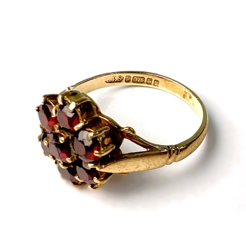 597 - A suite of garnet set 9carat hallmarked gold jewellery including brooch in the form of a flower; two... 