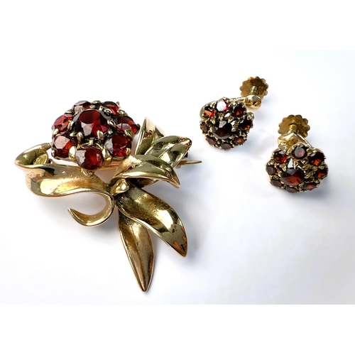 597 - A suite of garnet set 9carat hallmarked gold jewellery including brooch in the form of a flower; two... 