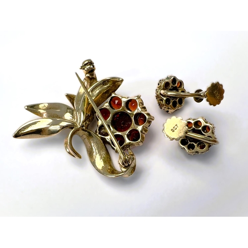 597 - A suite of garnet set 9carat hallmarked gold jewellery including brooch in the form of a flower; two... 