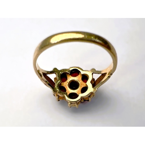 597 - A suite of garnet set 9carat hallmarked gold jewellery including brooch in the form of a flower; two... 