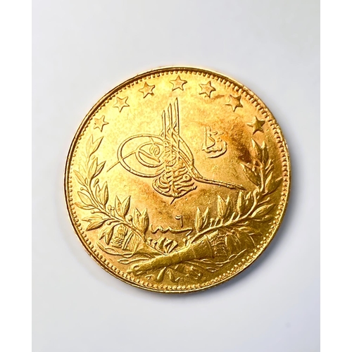 600 - A Middle Eastern gold coin with Arabic script, tests as 18carat plus, 7grams.