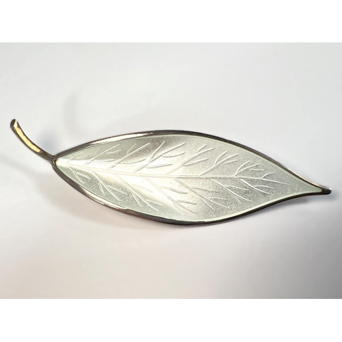 602 - A Norwegian white enamel and silver leaf brooch stamped 