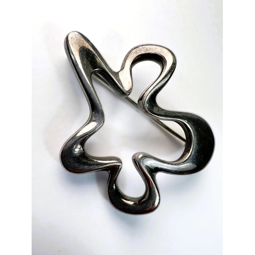 603 - A George Jensen brooch of looped form, stamped 