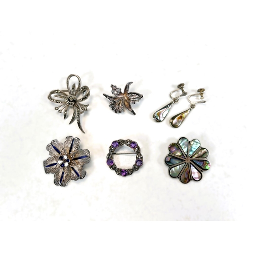 604 - An abalone pendant and matching earrings; four decorative early/mid 20th Century brooches.