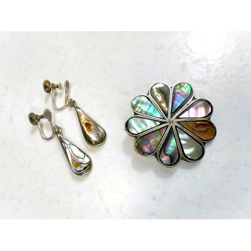 604 - An abalone pendant and matching earrings; four decorative early/mid 20th Century brooches.