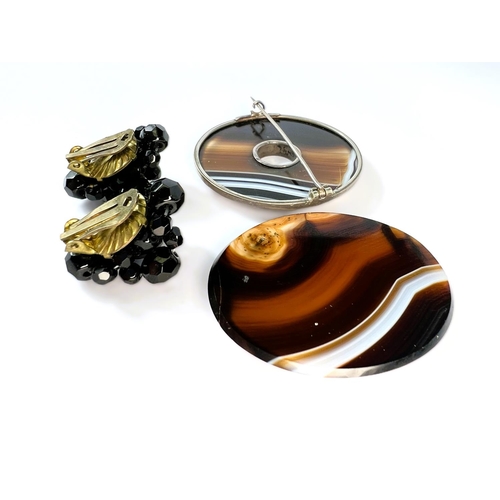 609 - A Victorian jet mourning brooch and earrings; a circular agate brooch and an agate oval plaque.