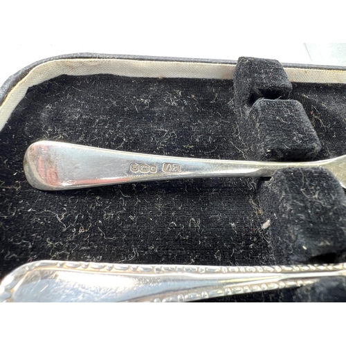 614 - A Silver scallop shaped caddy spoon, Sheffield 1973, five silver cake forks, a pair of tongs  3.5oz ... 