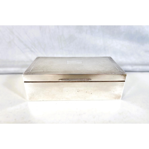 618 - A silver cased cigarette box, engine turned decoration, 17cm, Birmingham, 1962 