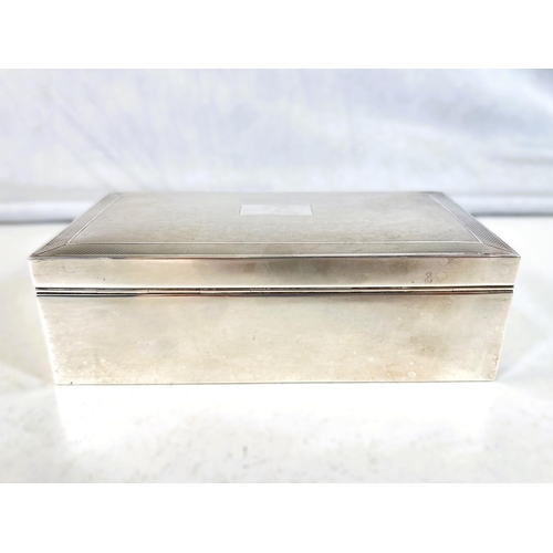 618 - A silver cased cigarette box, engine turned decoration, 17cm, Birmingham, 1962 