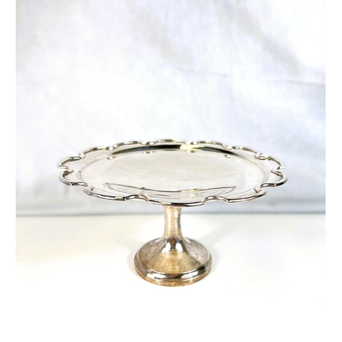 620 - A silver pedestal fruit dish with plain pie crust border, Birmingham 1931, 10.5oz (engraved inscript... 