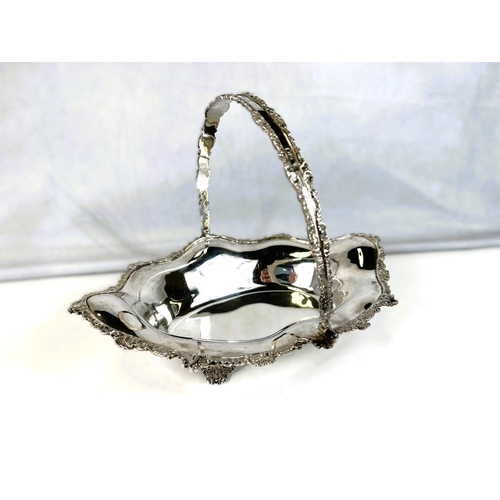 622 - A silver Victorian style sloped oval fruit dish with swag handle, cast scrollwork borders, 4 pierced... 