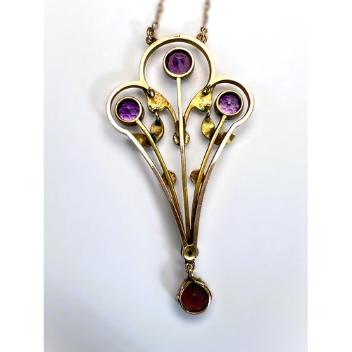 629 - An Edwardian 9ct gold pendant set with amethysts and seed pearls on fine chain stamped