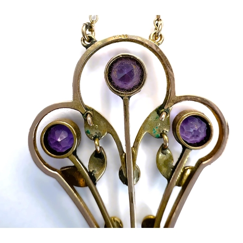 629 - An Edwardian 9ct gold pendant set with amethysts and seed pearls on fine chain stamped