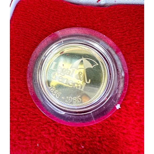 634 - A 9 carat Legal and General medallion, 7gms, cased with certificates.