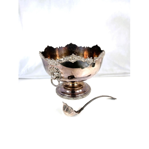 636 - A large silver plate punch bowl and ladle.