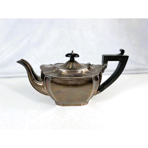 639 - A shaped oval, ribbed, hallmarked silver teapot, inscribed: Birmingham 1926.  22oz (686gms)