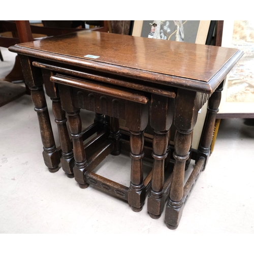 854 - A nest of three oak occasional tables, a barley twist occasional table and a bobbin leg stool.