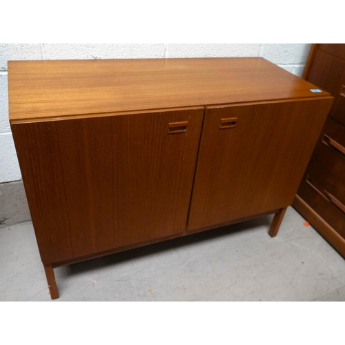 859 - A mid 20th Century teak side cabinet with double doors; a teak two height wall hanging shelf unit.