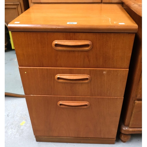 979 - A teak bedside chest of three drawers