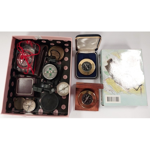 206 - A collection of vintage and later compasses, some military style